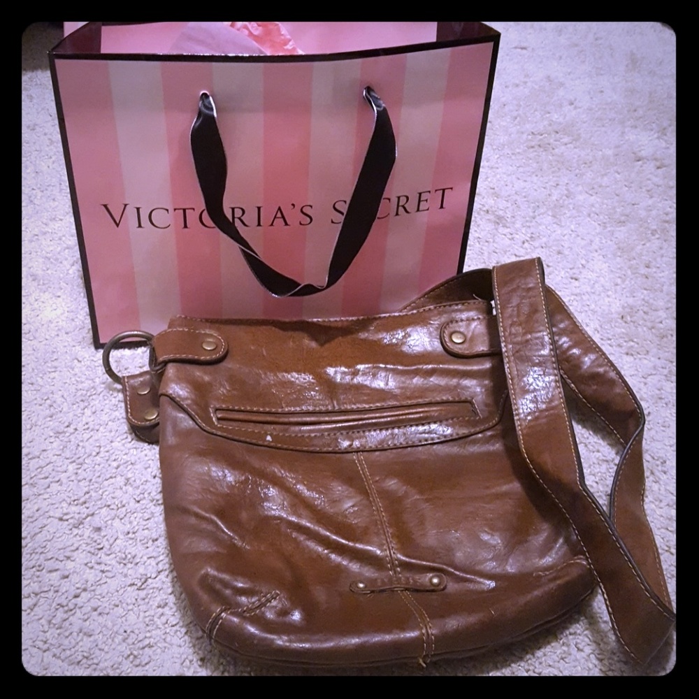 Victoria Secret lotion and a leather purse.